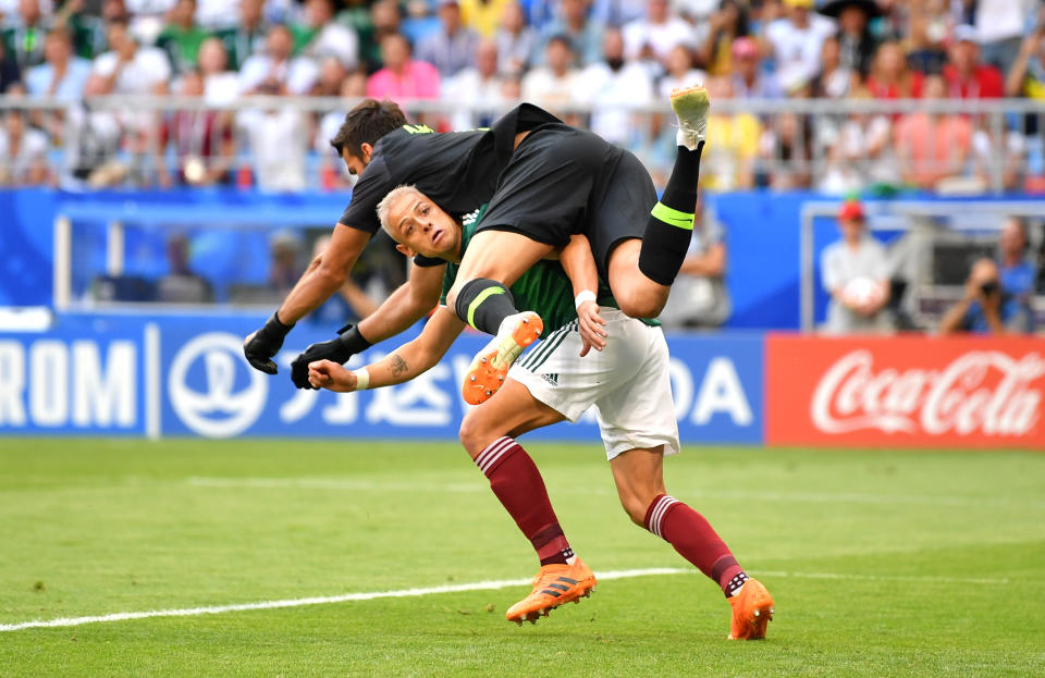 <p>Javier Hernandez of Mexico collides with Alisson of Brazil as they compete for the ball during the 2018 FIFA World Cup Russia Round of 16 match between Brazil and Mexico at Samara Arena on July 2, 2018 in Samara, Russia. (Photo by Dan Mullan/Getty Images) </p>