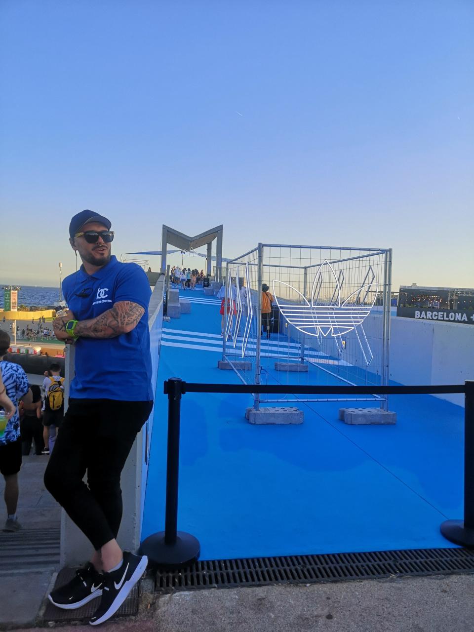 An security guard in front of the Adidas private area located at the festival.