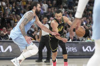 Memphis Grizzlies' Steven Adams (4) defends Golden State Warriors' Stephen Curry (30) in the first half of Game 5 of an NBA basketball second-round playoff series Wednesday, May 11, 2022, in Memphis, Tenn. (AP Photo/Karen Pulfer Focht)