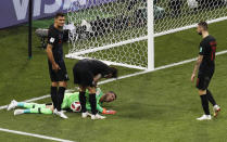 <p>Croatia goalkeeper Danijel Subasic grimaces on the ground after injuring his hamstring </p>