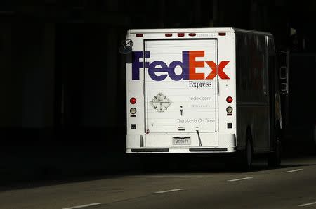 A Federal Express truck on delivery is pictured in downtown Los Angeles, California October 29, 2014. REUTERS/Mike Blake