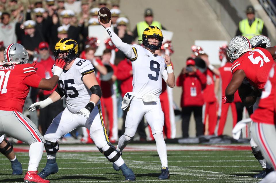 Michigan quarterback J.J. McCarthy (9) passes against Ohio State during the first half at Ohio Stadium in Columbus on Nov. 26, 2022.