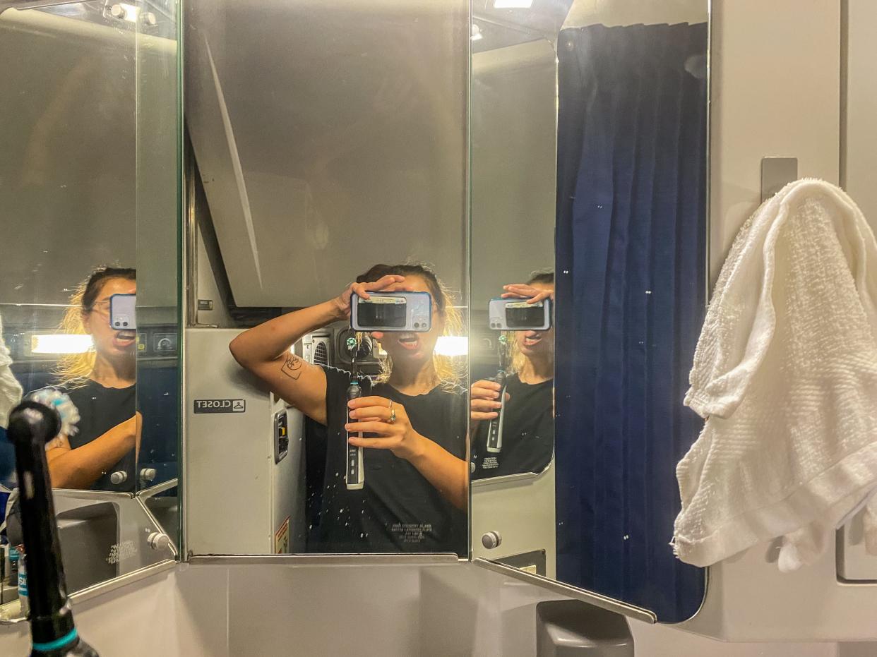 The author brushes her teeth in front of the sink