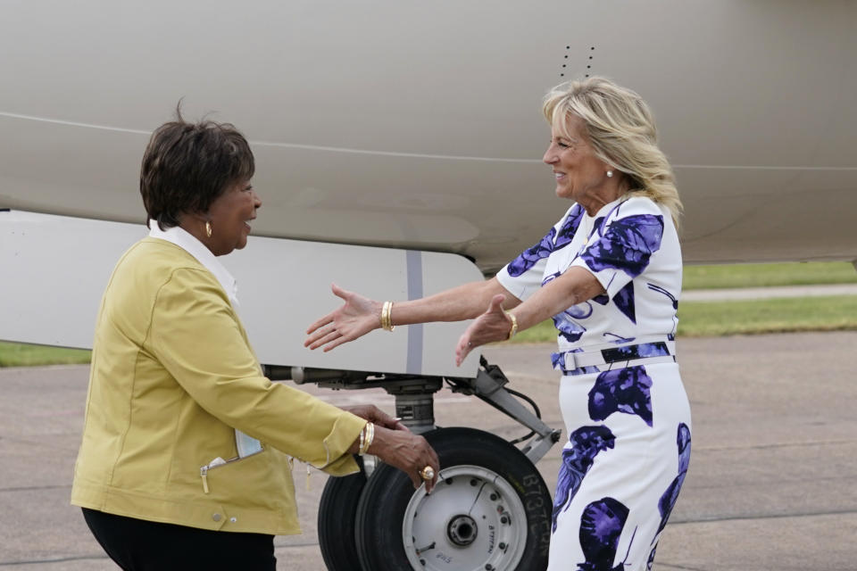 First lady Jill Biden greets Rep. Eddie Bernice Johnson, D-Texas, as she arrives at Love Field Airport in Dallas, Tuesday, June 29, 2021. (AP Photo/Carolyn Kaster, Pool)