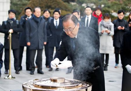 Former U.N. secretary-general Ban Ki-moon burns incense during his visits to the natioanl cemetery in Seoul, South Korea, January 13, 2017. REUTERS/Kim Hong-Ji