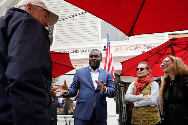 <p>AP Photo/Steven Senne</p> Gabo Amo speaks with potential voters in Providence, Rhode Island, on Nov. 6, 2023