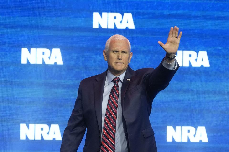 Former Vice President Mike Pence waves after speaking during at the National Rifle Association Convention, Friday, April 14, 2023, in Indianapolis.
