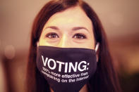 FILE - In this Wednesday, Sept. 16, 2020 file photo, Hungarian MEP Katalin Cseh wears a protective face mask with a message as she attends a plenary session at the European Parliament in Brussels. Cseh, a liberal Hungarian EU lawmaker, told The Associated Press it was "outrageous and deeply concerning" that senior Fidesz politicians and pundits were "openly calling to consider" Hungary's EU exit. (AP Photo/Francisco Seco, File)