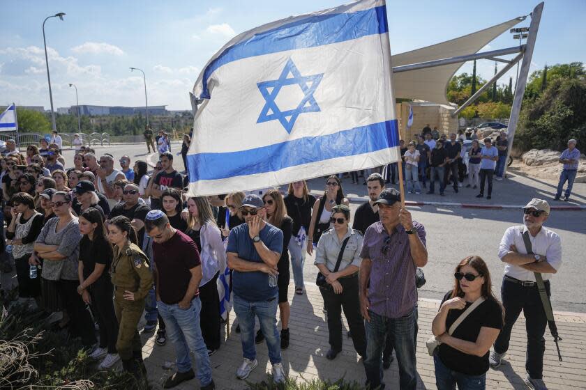 Mourners attend the funeral of Israeli soldier, Noa Marciano, in Modiin, Israel, Friday, Nov. 17, 2023. The Israeli military said Marciano's body was found in a building near Shifa Hospital in the Gaza Strip and brought to Israel for identification by the military rabbinate. Marciano is one of three hostages declared dead since October 7. (AP Photo/Ohad Zwigenberg)