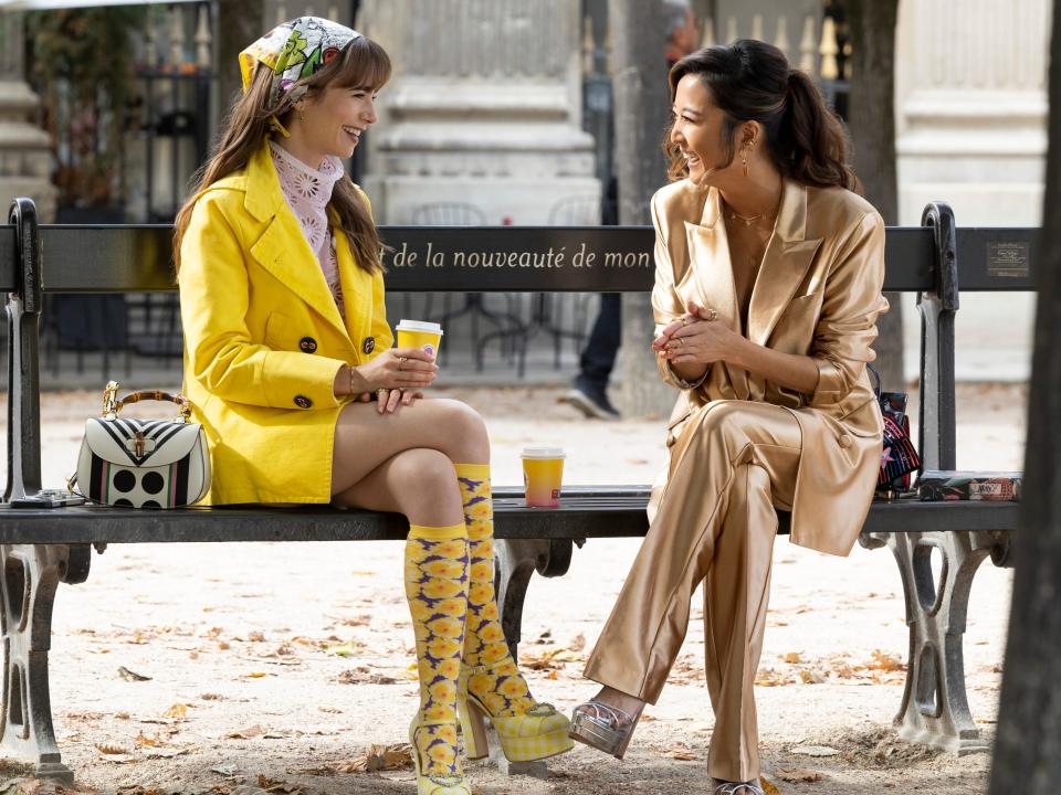 Emily and Mindy sitting on a bench in emily in paris season 3