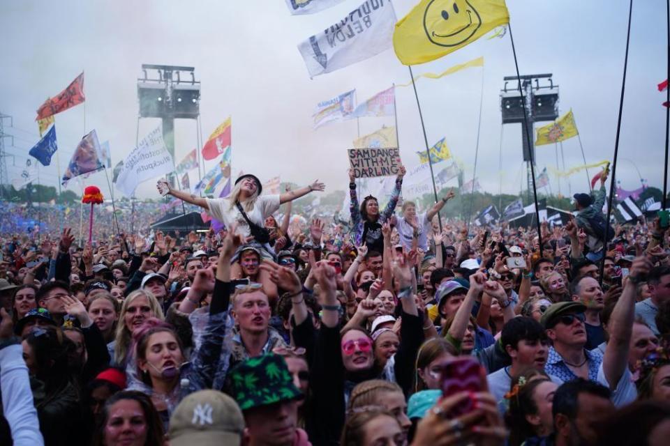 Crowds at Glastonbury stand and cheer