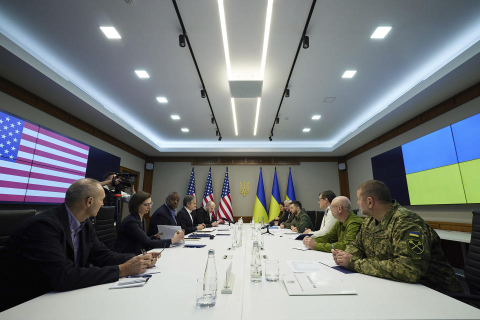 FILE - In this image from video provided by the Ukrainian Presidential Press Office and posted on Facebook, April 25, 2022, U.S. Secretary of Defense Lloyd Austin, third from left, and Secretary of State Antony Blinken, fourth from left, attend their meeting with Ukrainian President Volodymyr Zelenskyy, fourth from right, in Kyiv, Ukraine. Even as Ukraine celebrates recent battlefield victories, its government faces a looming challenge on the financial front: how to pay the enormous cost of the war effort without triggering out-of-control price spikes for ordinary people or piling up debt that could hamper postwar reconstruction. So far, the U.S. has been the leading donor, giving $15.2 billion in financial assistance and $52 billion in overall aid, including humanitarian and military assistance, through Oct. 3, according to the Ukraine Support Tracker at the Kiel Institute for the World Economy. (Ukrainian Presidential Press Office via AP, File)