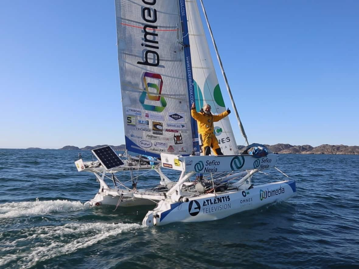 Yvan Bourgnon aboard his catamaran, Ma Louloutte, in 2017 as he embarked on a journey through the Northwest Passage. (Submitted by Yvan Bourgnon - image credit)