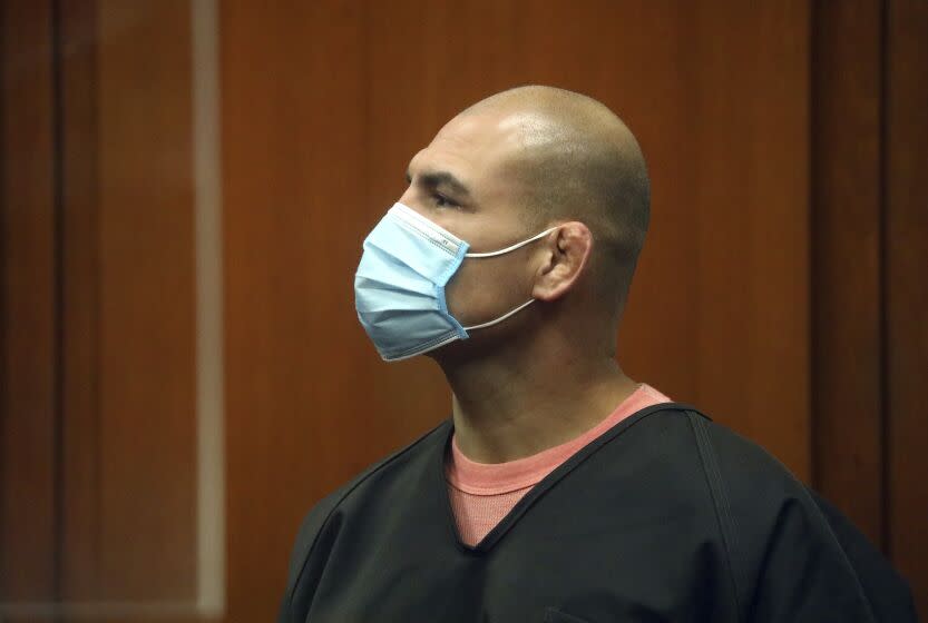 Cain Velasquez listens during a hearing at the Santa Clara County Hall of Justice on Monday, March 7, 2022, in San Jose, Calif. A judge had denied bail to former UFC heavyweight champion Velasquez, who was charged with attempted murder after authorities said he fired at a pickup truck carrying a man accused of sexually abusing a 4-year-old family member. Velasquez was arrested last week in San Jose. (Aric Crabb/Bay Area News Group, Pool via AP)