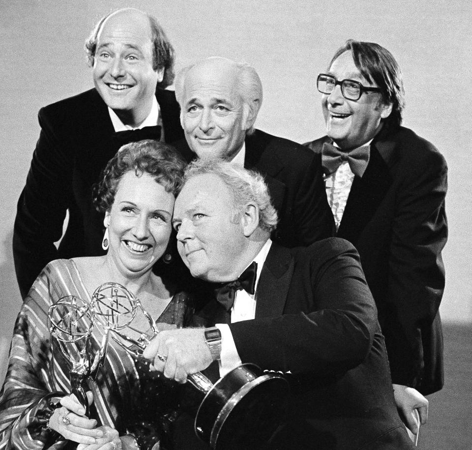 FILE - Actors Jean Stapleton, seated, left, and Carroll O'Connor, seated, right, from "All in the Family" hold their Emmys for outstanding lead actress and actor in a comedy series, as they pose with co-star Rob Reiner, who won for supporting actor in a comedy series, standing left, producer Norman Lear, and executive producer Mort Lachman, standing right, in Los Angeles on Sept. 18, 1978. Lear, the writer, director and producer who revolutionized prime time television and propelled political and social turmoil into the once-insulated world of sitcoms, died Tuesday, Dec. 5, 2023, at age 101. (AP Photo, File)