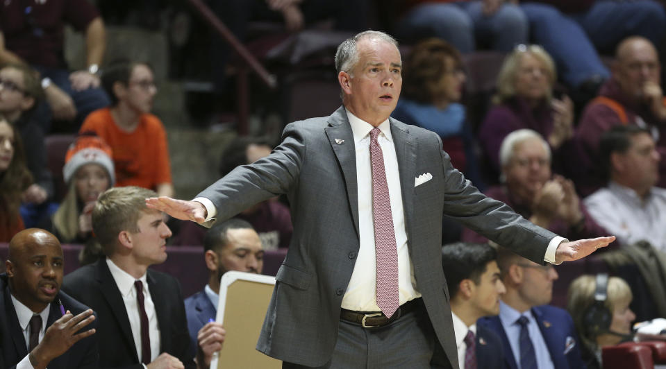 Virginia Tech head coach Mike Young signals while his team plays defense against Chattanooga in the first half of an NCAA college basketball game, Wednesday, Dec. 11, 2019, in Blacksburg, Va. (Matt Gentry/The Roanoke Times via AP)