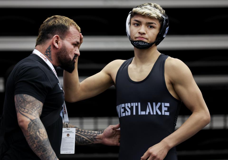 Westlake’s Israel Borge, right, gets ready to compete in the 6A Wrestling State Championships at the UCCU Center in Orem on Friday, Feb. 16, 2024. | Laura Seitz, Deseret News