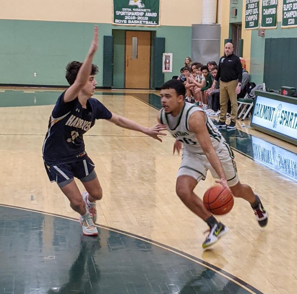 Oakmont's Jordan Pantojas (20) drives against Hanover's Tyler Vincent (3) during the MIAA Division 3 Sweet 16 game in Ashburnham.