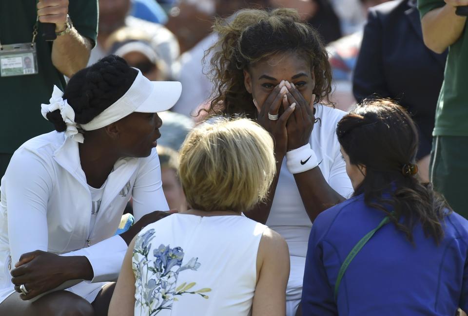 Serena Williams of the U.S. appears unwell before her women's doubles tennis match with Venus Williams of the U.S. against Kristina Barrois of Germany and Stefanie Voegele of Switzerland at the Wimbledon Tennis Championships, in London