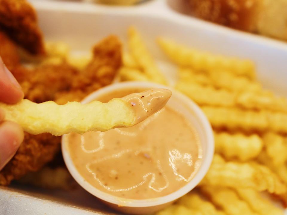 raising canes fries dipped in canes sauce