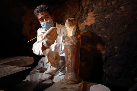 An archaeologist works inside the tomb of Khufu-Imhat, at the Saqqara area near its necropolis, in Giza, Egypt November 10, 2018. REUTERS/Mohamed Abd El Ghany