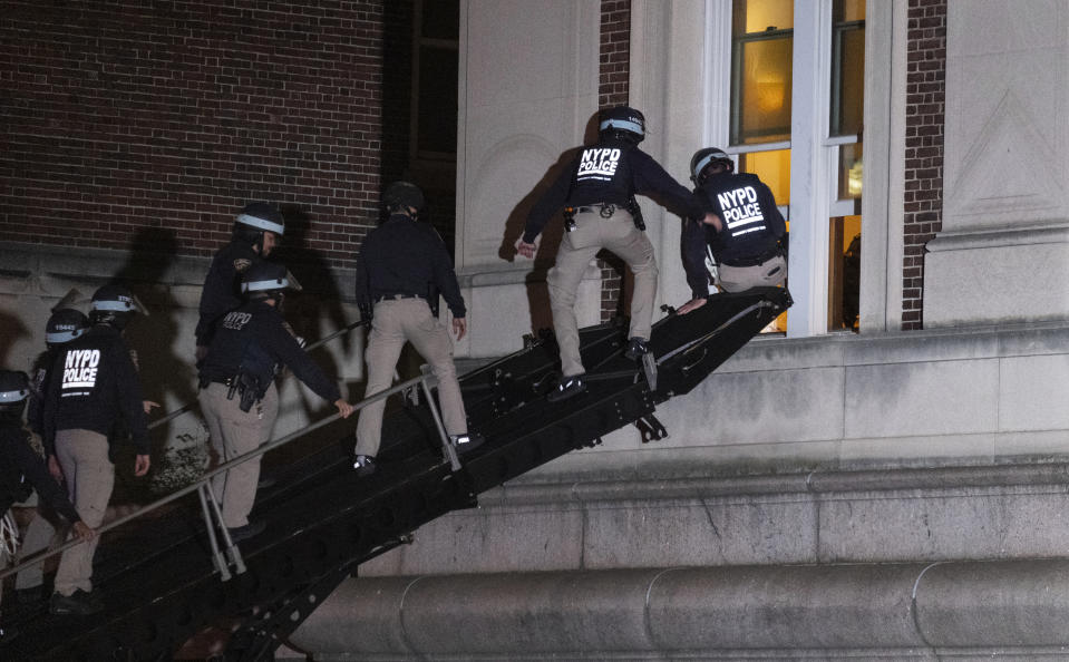 FILE - New York City police enter an upper floor of Hamilton Hall on the Columbia University campus using a tactical vehicle, in New York Tuesday, April 30, 2024, after a building was taken over by protesters earlier Tuesday. Colleges and universities have long been protected places for free expression without pressure or punishment. But protests over Israel's conduct of the war in Gaza in its hunt for Hamas after the Oct. 7 massacre has tested that ideal around the world. (AP Photo/Craig Ruttle, File)