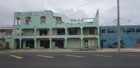 A damaged building is seen after Super Typhoon Yutu hit Saipan, Northern Mariana Islands, U.S., October 25, 2018 in this image taken from social media. Brad Ruszala via REUTERS