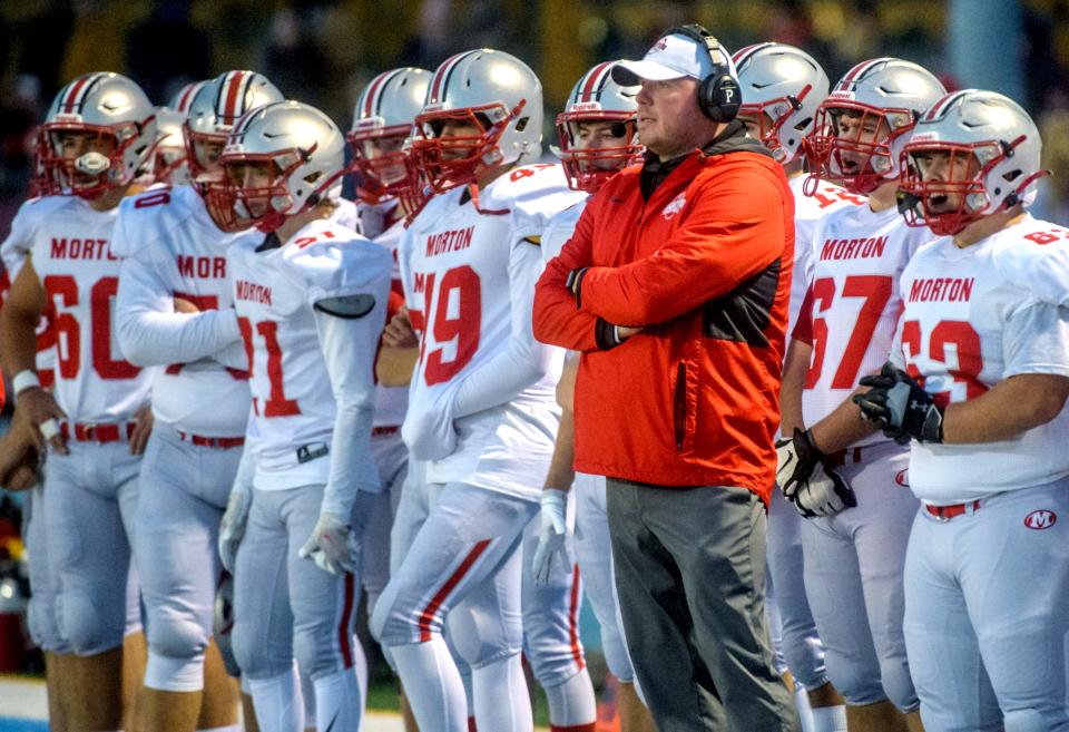 Morton Potters' head coach Tim Brilley and the rest of the team watch from the sidelines as they battle Kankakee in the second half of their Class 5A state football semifinal Saturday, Nov. 20, 2021 in Kankakee. Morton fell to the Kays 41-14.