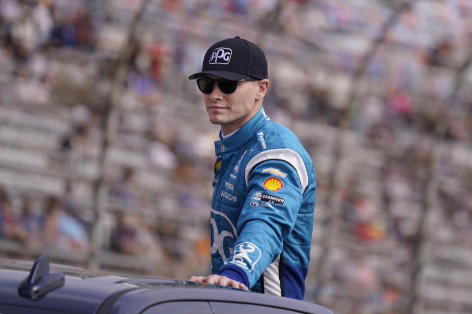 Josef Newgarden rides atop a truck during introductions for the IndyCar auto race at Texas Motor Speedway in Fort Worth, Texas, Sunday, April 2, 2023. (AP Photo/LM Otero)