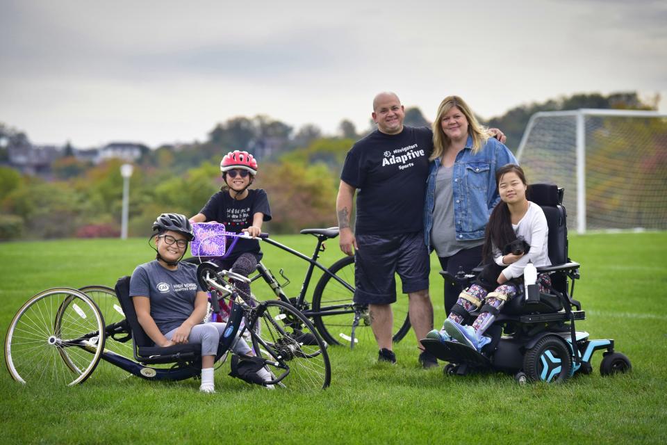 The Emory family: Pete and Holly with their three daughters, Mia, 17, Yiman, 11 and Sofia, 12, who have physical disabilities, photographed at Raritan Bay Waterfront Park in South Amboy on Oct. 16, 2022.