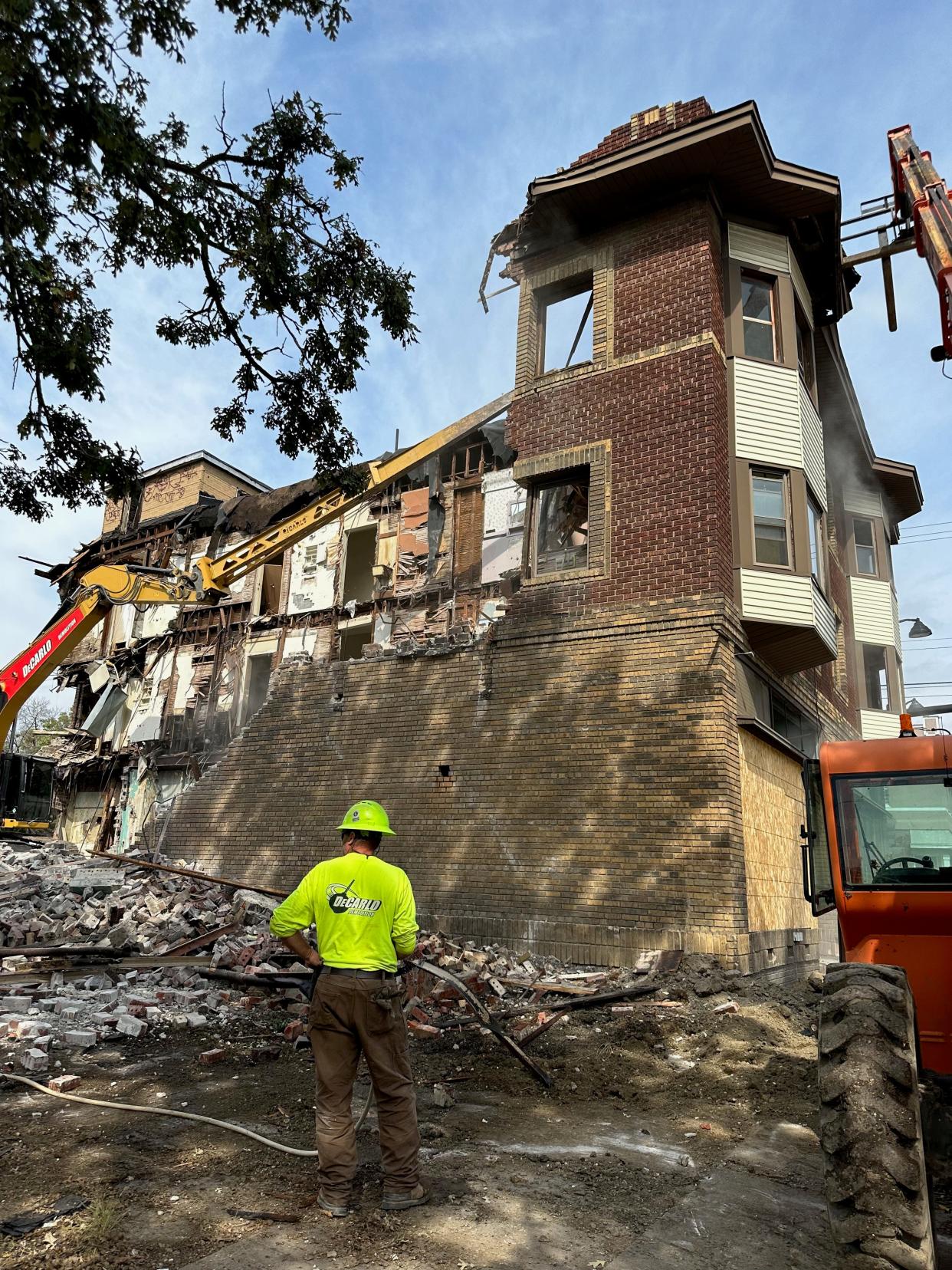 Demolition begins on the Highland Apartments building at the intersection of Sixth and Euclid Avenues in September 2023.