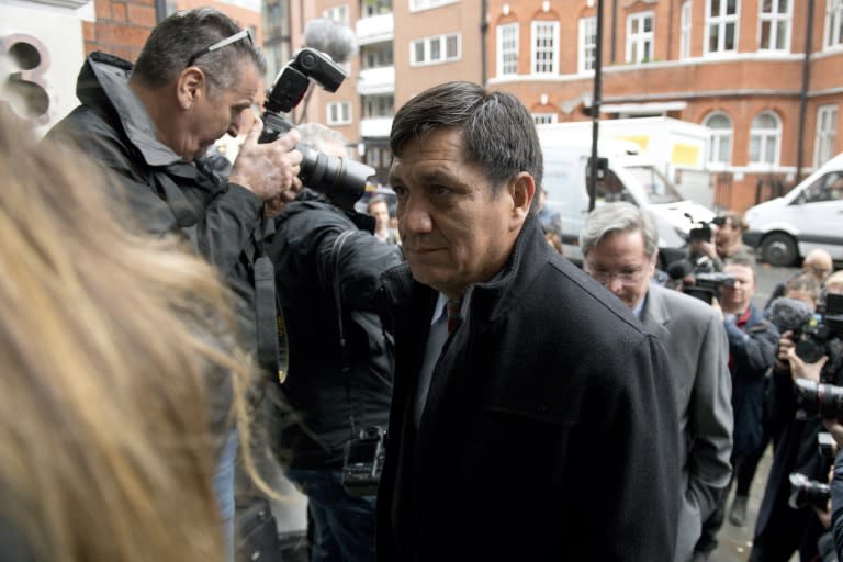 Ecuadorian prosecutor, Wilson Toainga (C) is surrounded by media as he arrives to attend an interview with WikiLeaks founder Julian Assange at the Ecadorian Embassy in London on November 14, 2016