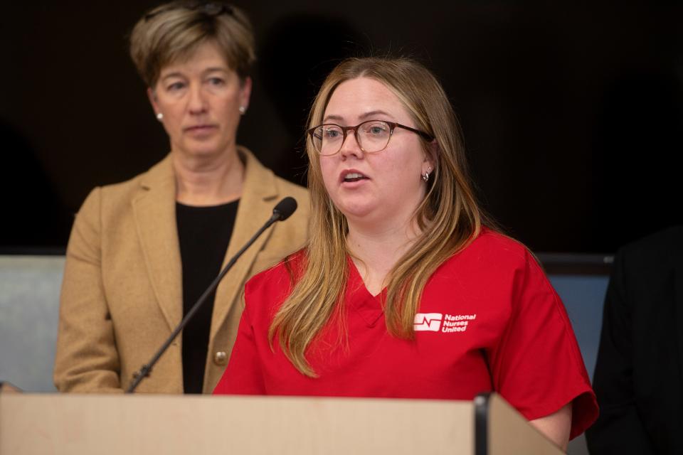 Hannah Drummond, an Emergency Department nurse at Mission Hospital, speaks during a press conference with North Carolina Attorney General Josh Stein and Senator Julie Mayfield, left, on the filing of a lawsuit against HCA, December 14, 2023.