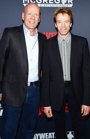 <p>Bryan Steffy/Getty</p> Bruce Willis and Jerry Bruckheimer in 2017