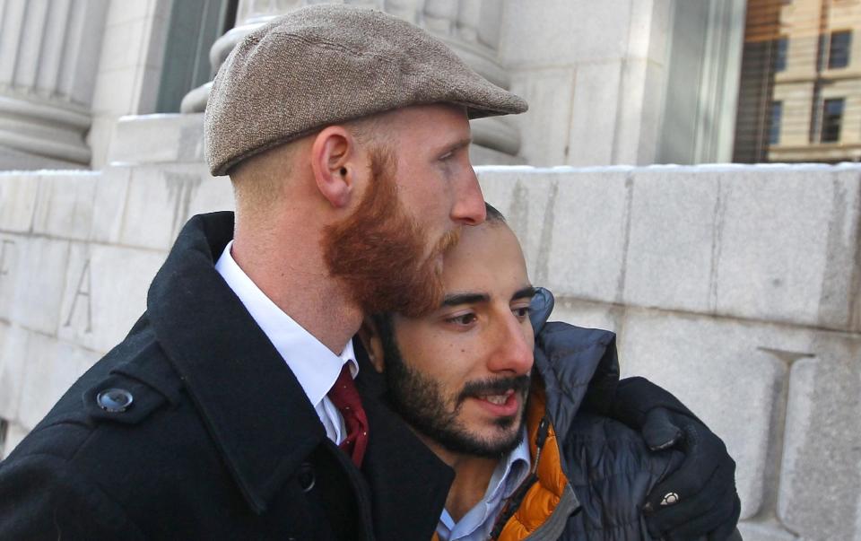 FILE - In this Dec. 4, 2013, file photo, Derek Kitchen, left, and his partner Moudi Sbeity hug each other outside Frank E. Moss United States Courthouse, in Salt Lake City. The young couple that has become the face of gay marriage in Utah is an unlikely pair for the role. Kitchen and Sbeity were both raised in conservative religious families that shun gays, Kitchen in a Mormon home in Utah and Sbeity in a Muslim family in Lebanon. They each came out when they were 16 years old, worlds apart, and met six years later in college in Utah. They chose to become one of three couples as plaintiffs in the lawsuit challenging Utah’s same-sex marriage to publicly push back against religions that oppress gays and lesbians. (AP Photo/Rick Bowmer, File)