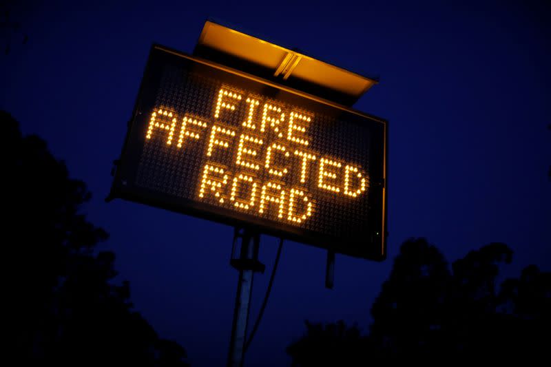 Signage is seen on the bushfire affected Bruthen-Buchan Road near Buchan, Victoria, Australia