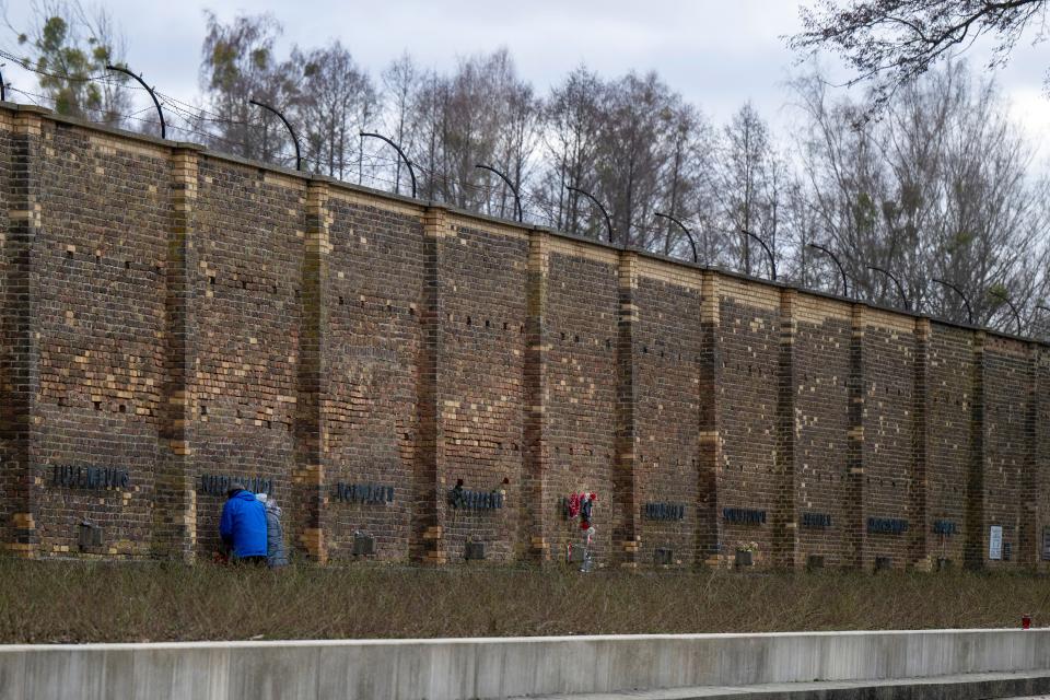 People visit the grounds of the Ravensbruck Memorial in Furstenberg/Havel, Germany, Saturday Jan. 27, 2024, on International Holocaust Remembrance Day marked on Jan. 27.