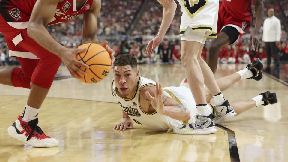 Gillis dives after a loose ball in the second half of the Final Four game against North Carolina State. - Jamie Squire/Getty Images