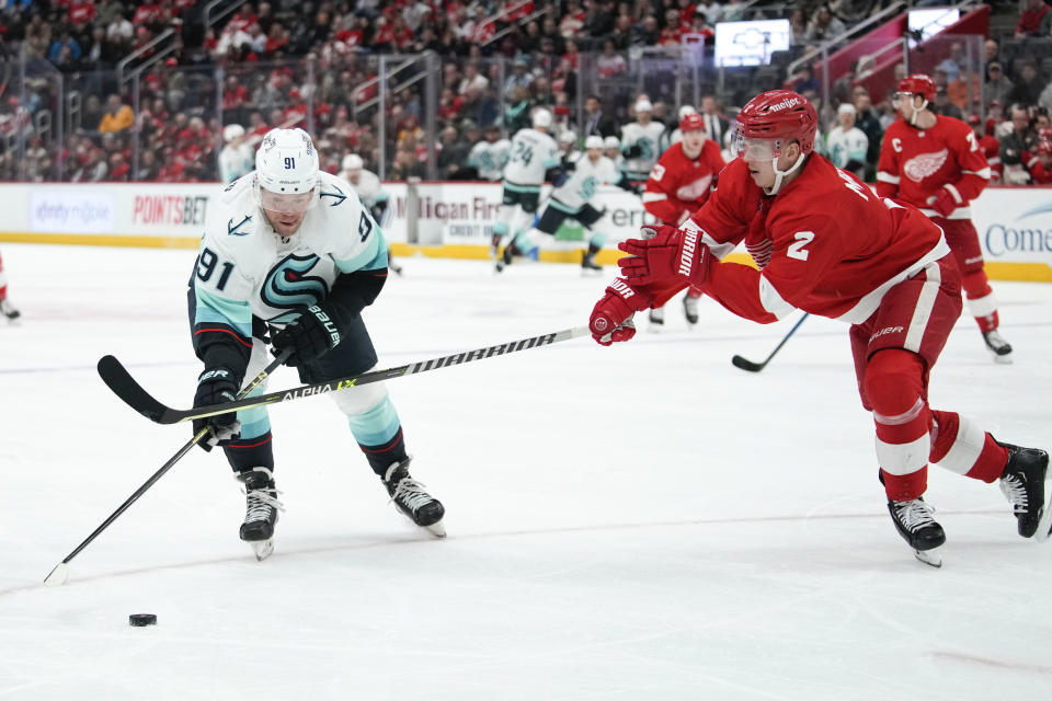 Detroit Red Wings defenseman Olli Maatta (2) defends Seattle Kraken right wing Daniel Sprong (91) in the first period of an NHL hockey game Thursday, March 2, 2023, in Detroit. (AP Photo/Paul Sancya)