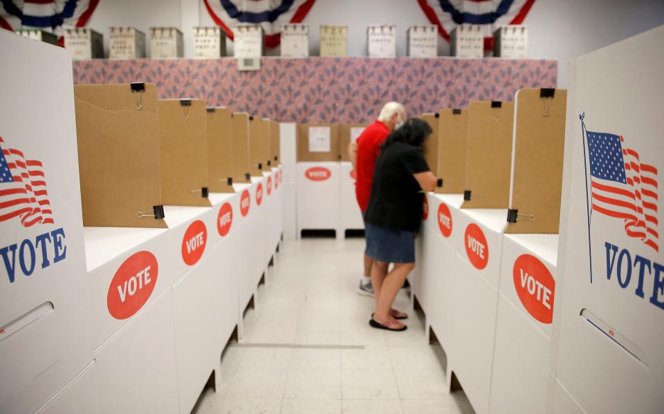 Voters cast their ballots during early voting at the Oklahoma County Election Board in Oklahoma City, Thursday, June 23, 2022. 