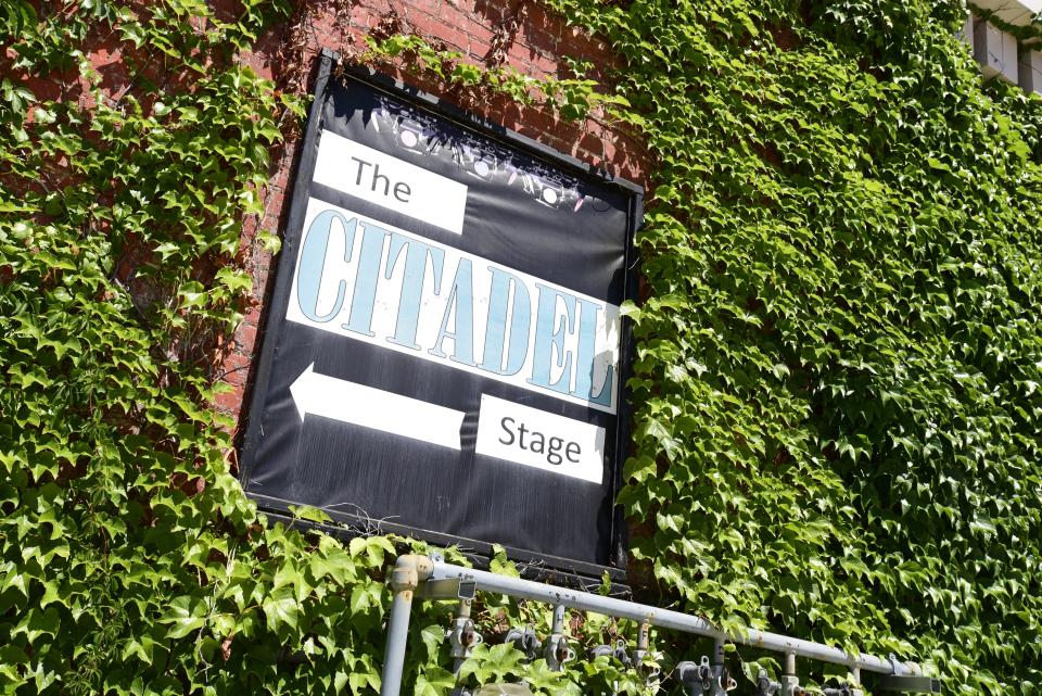 A stage banner at the Citadel building on Huron Ave., in downtown Port Huron on Friday, August 12, 2022. The building which includes the theatre space occupied by Enter Stage Right, a Primerica office space, Red Kettle Coffee Roasters, and upstairs lofts, is up for sale by the owners.