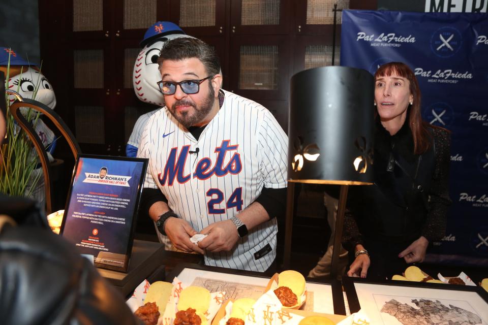 Queens, NY - March 21, 2024 -- Adam Richman of Adam Richman's Burger Hall of Fame at Citifield. The NY Mets hosted the 2024 What's New at Citi Field Day, showcasing the added attractions and food that fans will find when baseball returns to Queens next week for opening day.