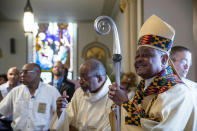 FILE - In this Sunday, June 2, 2019, file photo, Washington D.C. Archbishop Wilton Gregory arrives to applause at St. Augustine Church for Sunday mass in Washington. Pope Francis has named 13 new cardinals, including Washington D.C. Archbishop Wilton Gregory, who would become the first Black U.S. prelate to earn the coveted red cap. In a surprise announcement from his studio window to faithful standing below in St. Peter’s Square, Sunday, Oct. 25, 2020, Pope Francis has named 13 new cardinals, including Washington D.C. Archbishop Wilton Gregory, who would become the first Black U.S. prelate to earn the coveted red cap. (AP Photo/Andrew Harnik, File)