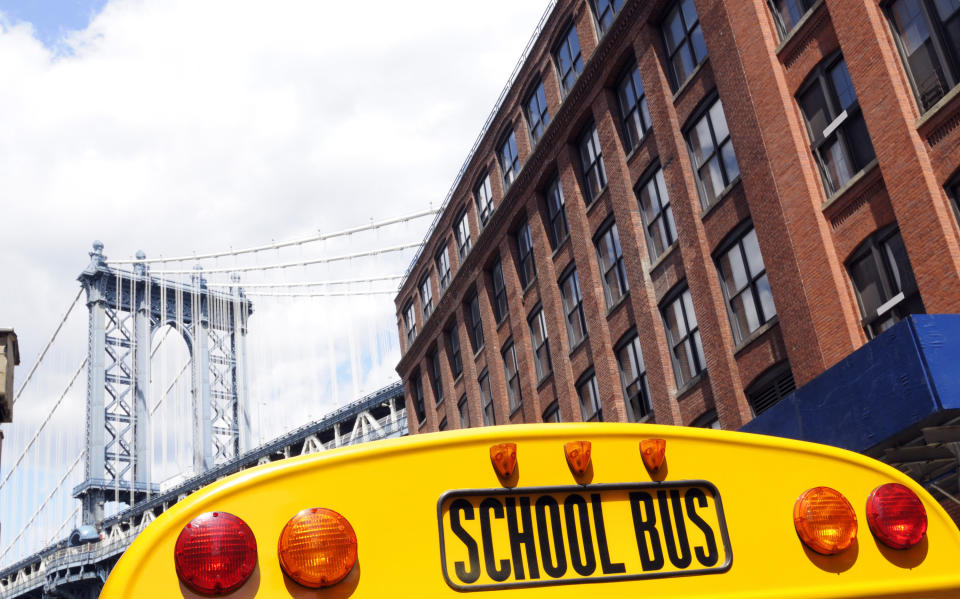 A school bus near the Brooklyn Bridge