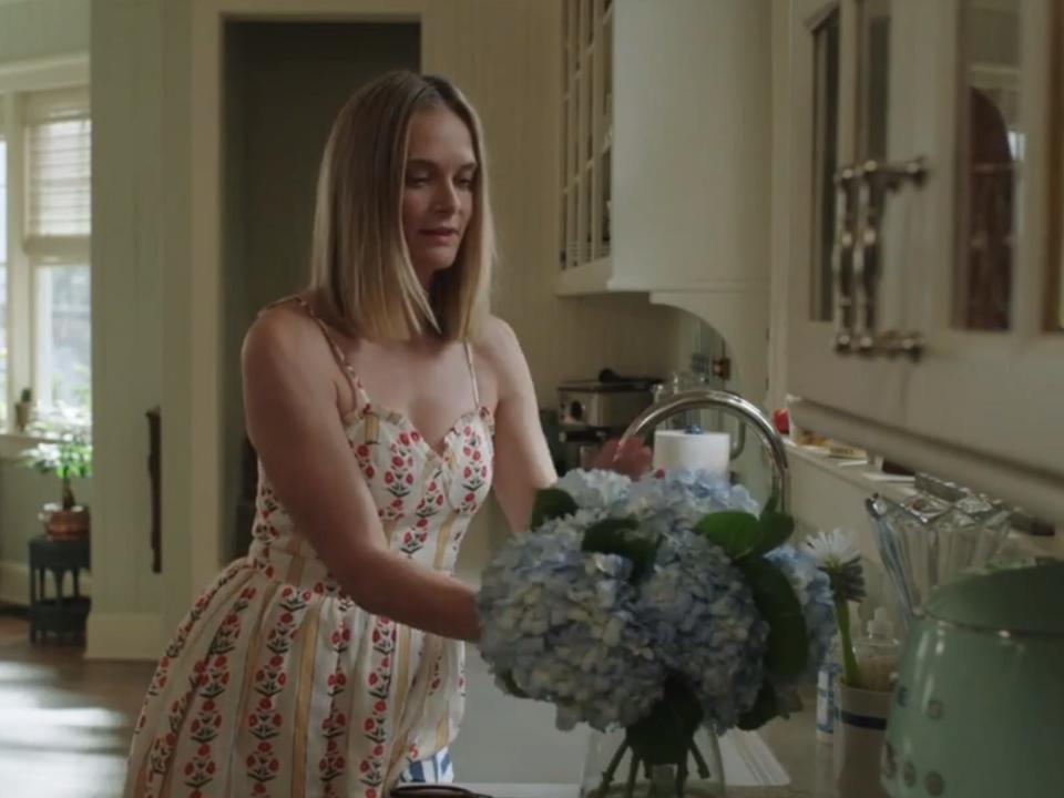 susannah prepping a vase of flowers in summer i turned pretty