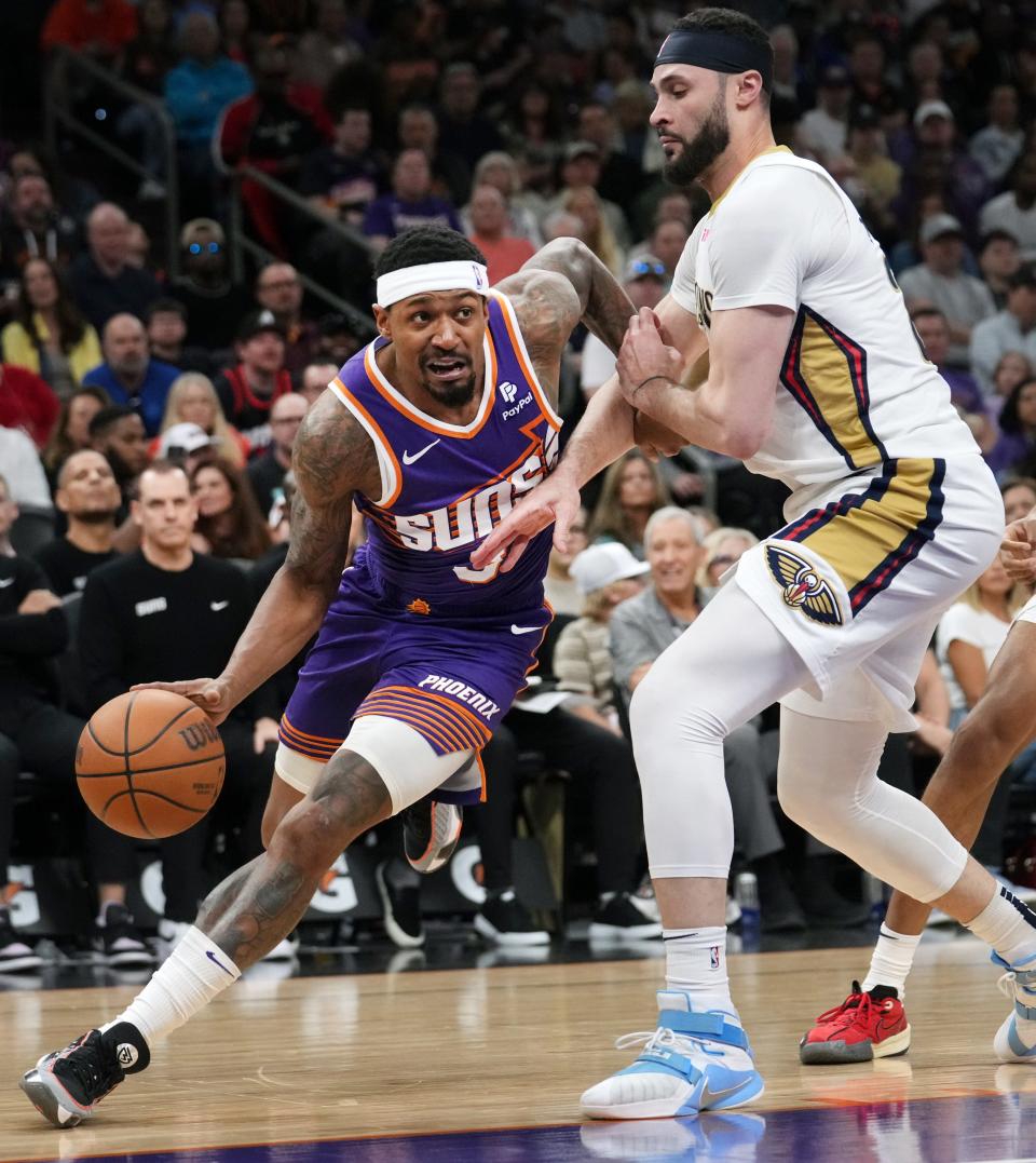 Phoenix Suns guard Bradley Beal drives past New Orleans Pelicans forward Larry Nance Jr. (22) at Footprint Center in Phoenix on April 7, 2024.