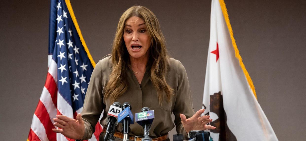 A woman stands behind a podium