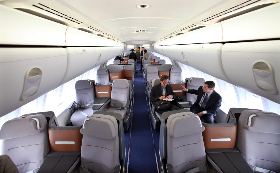 The business class section of the first Boeing 747-8 Intercontinental is seen before a delivery ceremony Tuesday, May 1, 2012, in Everett, Wash. Lufthansa is the launch customer for the Intercontinental and will start service with the airplane between Frankfurt, Germany and Washington, D.C. The 747-8 Intercontinental is a stretched, updated version of the iconic 747 and is expected to bring double-digit improvements in fuel burn and emissions over its predecessor, the 747-400, and generate 30 percent less noise. Boeing delivered the first 747-8 Intercontinental to a private customer in February, more than a year after originally planned. (AP Photo/Elaine Thompson)