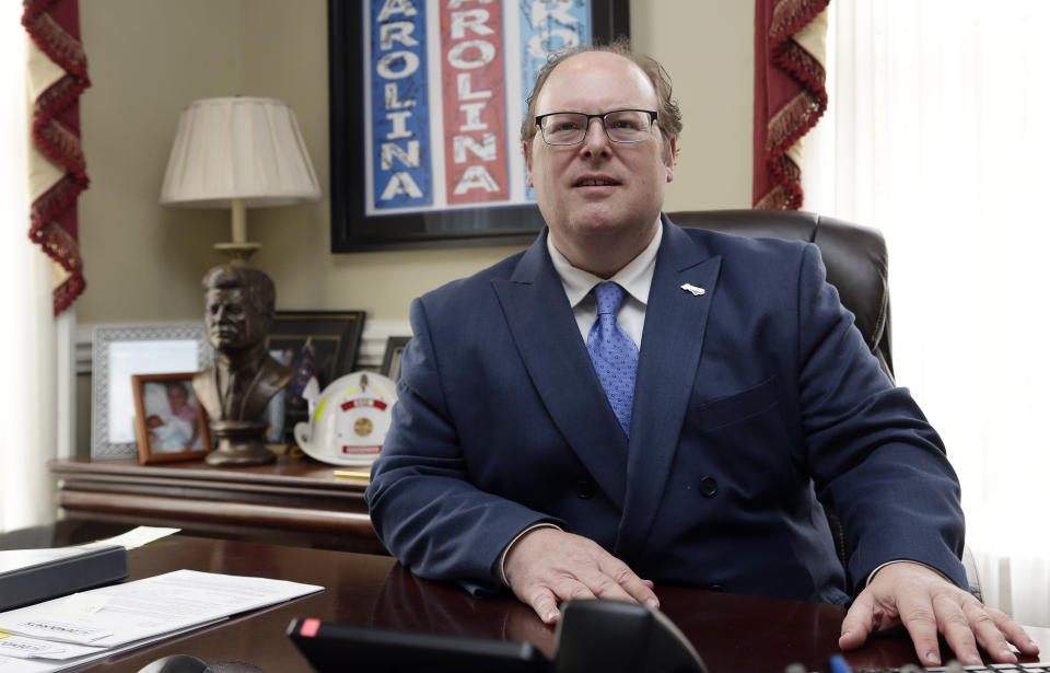 State Democratic Party Chairman Wayne Goodwin poses in his office at the Democratic party headquarters in Raleigh, N.C., Friday, April 5, 2019. Goodwin spoke to The Associated Press on Friday in his first interview since federal bribery and conspiracy charges were lodged against donor Greg Lindberg and state Republican Party Chairman Robin Hayes. (AP Photo/Gerry Broome)