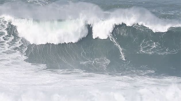 Porcella was dwarfed by this Nazare monster. Pic: Twitter